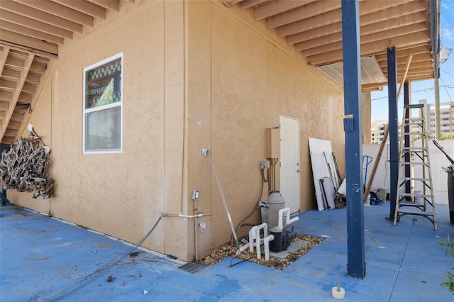 13810 Celida Ave, Hudson, FL 34667 - view of home's exterior with a patio and stucco siding