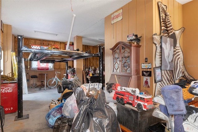 13810 Celida Ave, Hudson, FL 34667 - interior space with wooden walls and unfinished concrete flooring