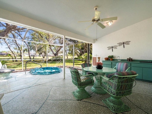 sunroom / solarium with a sink