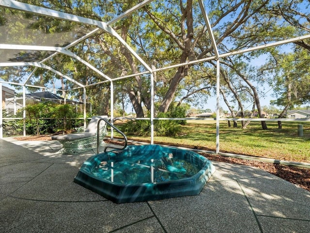 view of patio featuring glass enclosure