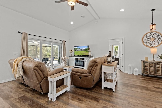 living room with dark wood finished floors, plenty of natural light, and beam ceiling
