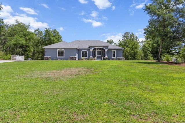 rear view of house with a yard