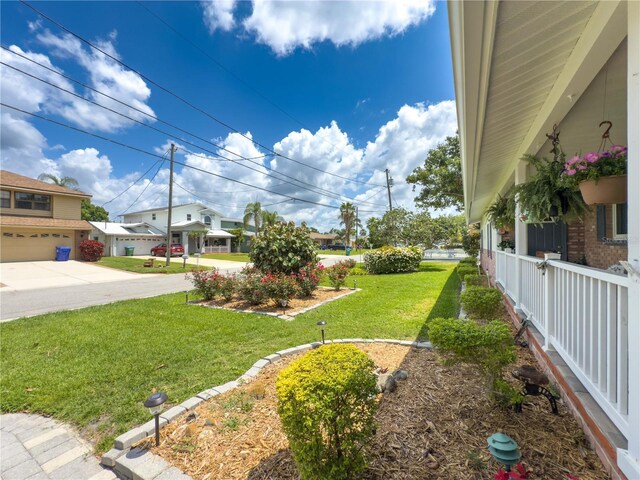 75 N Canal Dr, Palm Harbor, FL 34684 - view of yard with concrete driveway