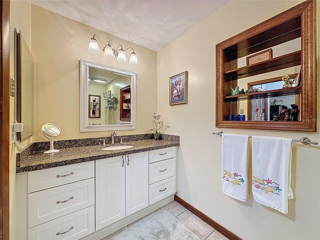 75 N Canal Dr, Palm Harbor, FL 34684 - bathroom featuring baseboards, tile patterned flooring, and vanity
