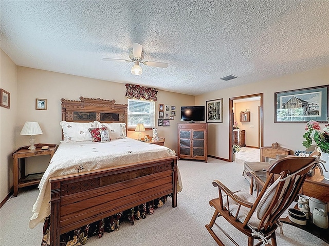 75 N Canal Dr, Palm Harbor, FL 34684 - bedroom featuring visible vents, baseboards, ceiling fan, light colored carpet, and a textured ceiling