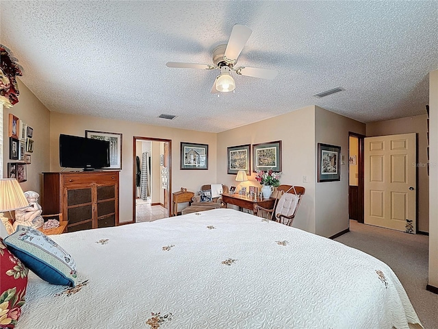 75 N Canal Dr, Palm Harbor, FL 34684 - carpeted bedroom with baseboards, a ceiling fan, a textured ceiling, and visible vents