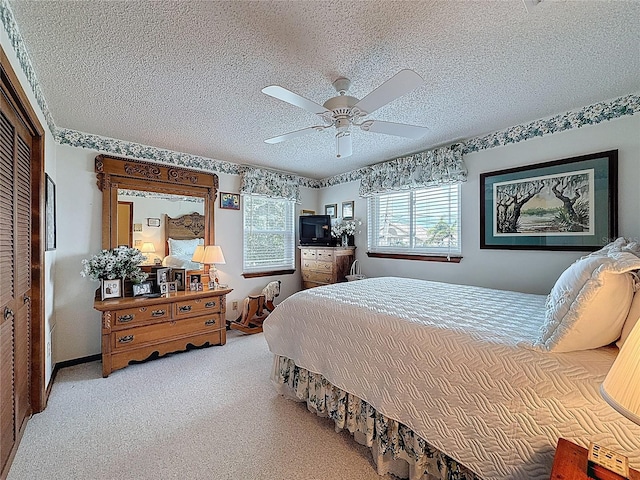 75 N Canal Dr, Palm Harbor, FL 34684 - bedroom with carpet floors, a ceiling fan, and a textured ceiling