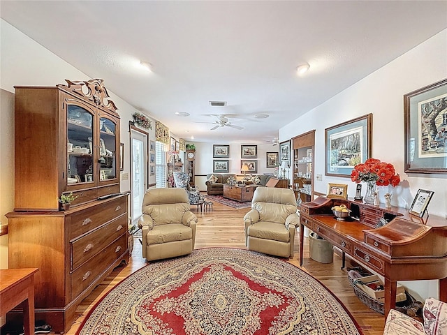 75 N Canal Dr, Palm Harbor, FL 34684 - living area featuring a ceiling fan, wood finished floors, and visible vents