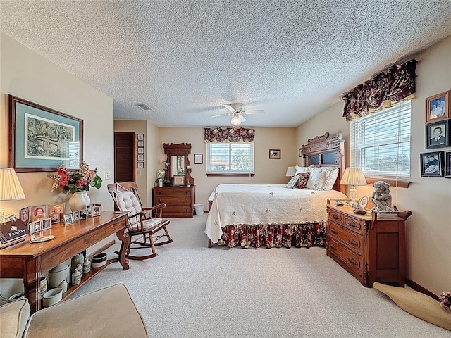 75 N Canal Dr, Palm Harbor, FL 34684 - carpeted bedroom featuring a textured ceiling, visible vents, and ceiling fan