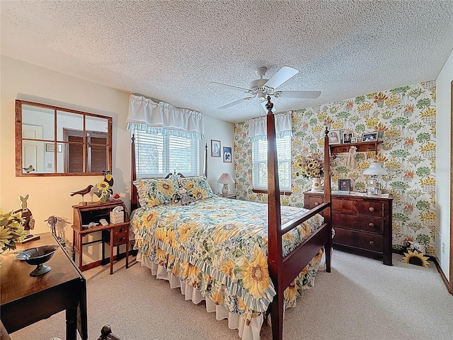 75 N Canal Dr, Palm Harbor, FL 34684 - carpeted bedroom with a ceiling fan, wallpapered walls, baseboards, and a textured ceiling