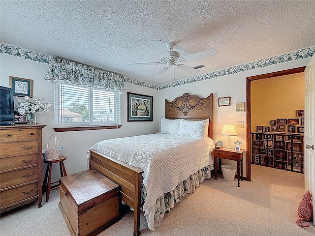 75 N Canal Dr, Palm Harbor, FL 34684 - carpeted bedroom featuring visible vents, a textured ceiling, and ceiling fan