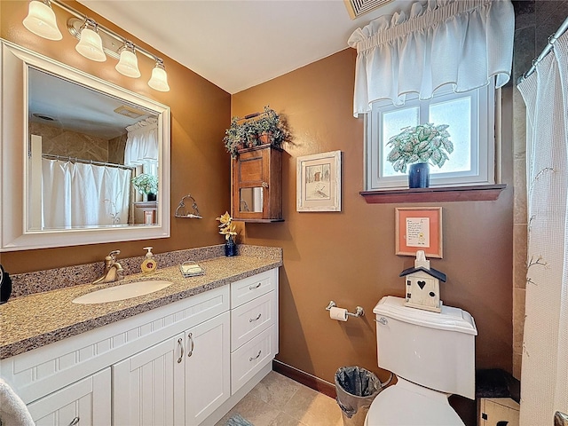 75 N Canal Dr, Palm Harbor, FL 34684 - bathroom featuring vanity, baseboards, a shower with shower curtain, and toilet