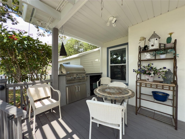 75 N Canal Dr, Palm Harbor, FL 34684 - wooden terrace featuring outdoor dining area and area for grilling
