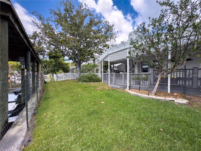 75 N Canal Dr, Palm Harbor, FL 34684 - view of yard with fence and a pergola