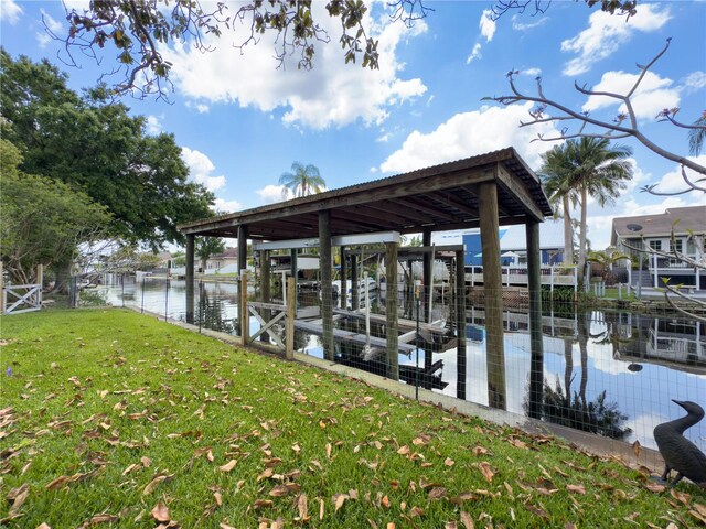 75 N Canal Dr, Palm Harbor, FL 34684 - dock area with a yard, a water view, and boat lift