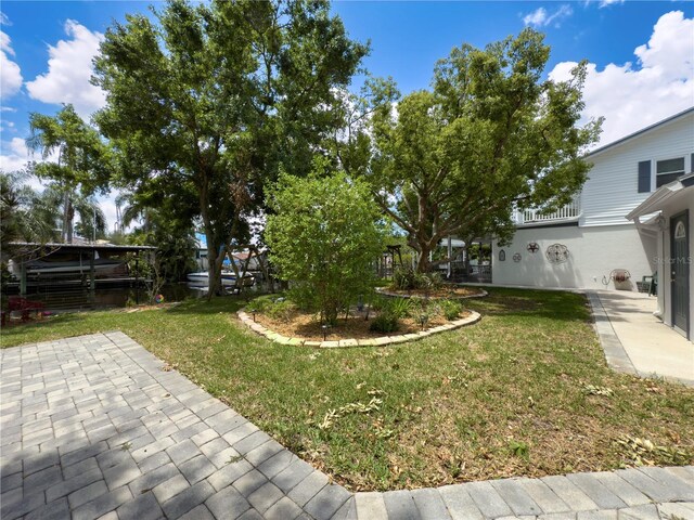 75 N Canal Dr, Palm Harbor, FL 34684 - view of yard with a patio