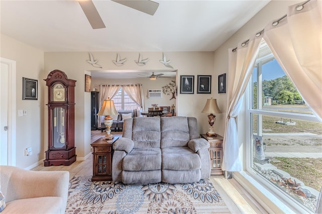 living area with a ceiling fan