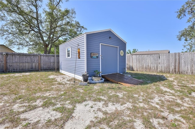 view of shed featuring a fenced backyard