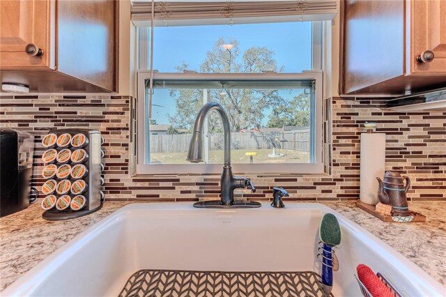 interior details with a sink and backsplash