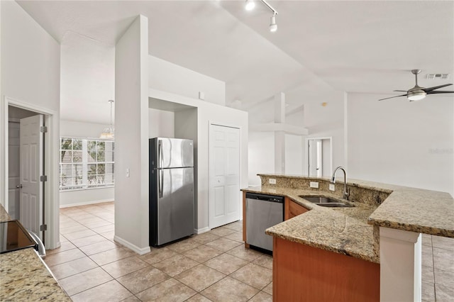 13098 Hanley Dr, Spring Hill, FL 34609 - kitchen with appliances with stainless steel finishes, a sink, light tile patterned flooring, track lighting, and high vaulted ceiling