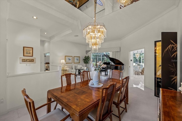 888 Royal Birkdale Dr, Tarpon Springs, FL 34688 - dining area featuring an inviting chandelier, ornamental molding, a towering ceiling, and recessed lighting