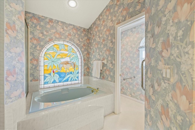 888 Royal Birkdale Dr, Tarpon Springs, FL 34688 - full bathroom with a garden tub, baseboards, and wallpapered walls