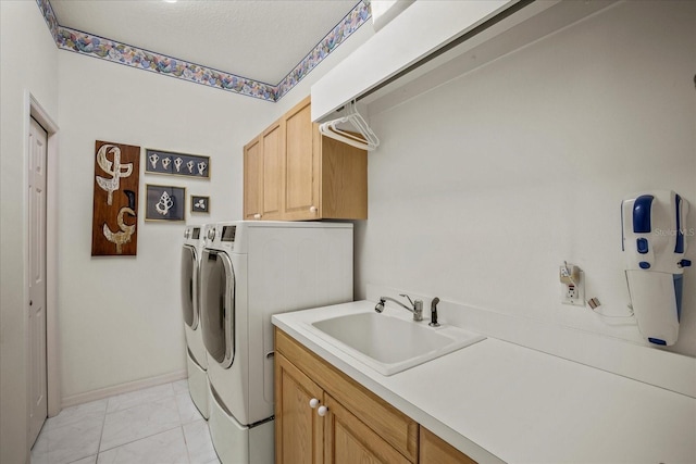 888 Royal Birkdale Dr, Tarpon Springs, FL 34688 - laundry area featuring washing machine and dryer, cabinet space, a sink, baseboards, and marble finish floor