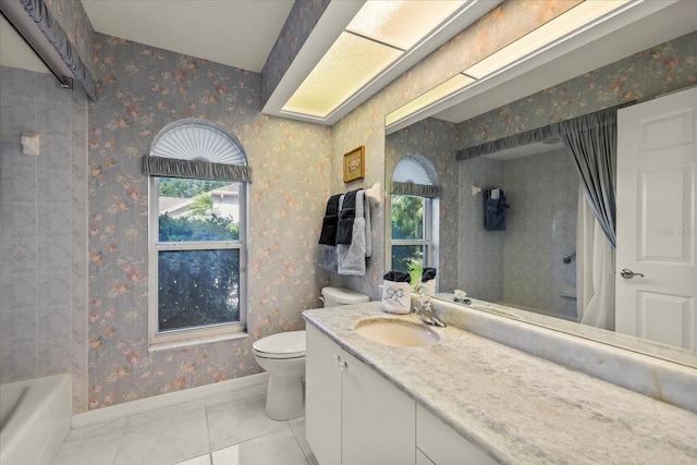 888 Royal Birkdale Dr, Tarpon Springs, FL 34688 - full bath featuring baseboards, vanity, toilet, marble finish floor, and wallpapered walls