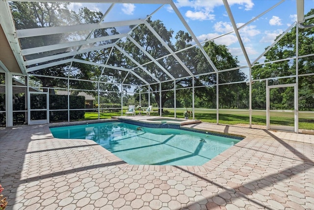 888 Royal Birkdale Dr, Tarpon Springs, FL 34688 - view of pool featuring a patio, a lanai, and a pool with connected hot tub