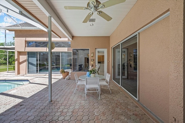 888 Royal Birkdale Dr, Tarpon Springs, FL 34688 - view of patio with a ceiling fan, a lanai, and an outdoor pool