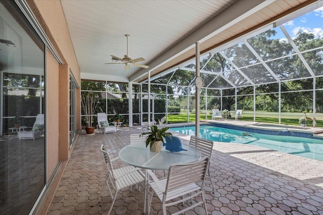 888 Royal Birkdale Dr, Tarpon Springs, FL 34688 - outdoor pool with glass enclosure, a patio, an in ground hot tub, and a ceiling fan