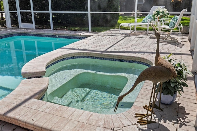 888 Royal Birkdale Dr, Tarpon Springs, FL 34688 - pool featuring glass enclosure, an in ground hot tub, and a patio area