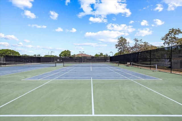 888 Royal Birkdale Dr, Tarpon Springs, FL 34688 - view of tennis court featuring fence and community basketball court