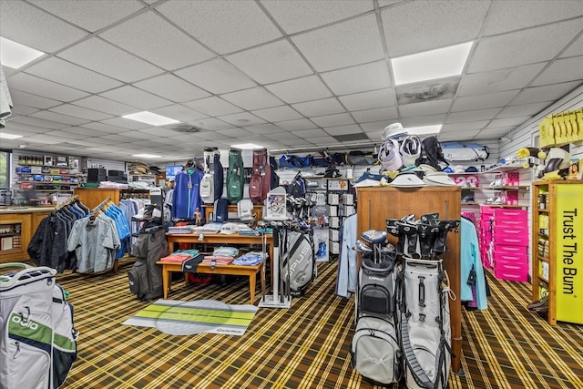 888 Royal Birkdale Dr, Tarpon Springs, FL 34688 - miscellaneous room with carpet flooring, a paneled ceiling, and a workshop area