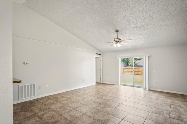 8461 Apple Orchard Rd, Spring Hill, FL 34608 - empty room featuring ceiling fan, a textured ceiling, tile patterned flooring, vaulted ceiling, and baseboards