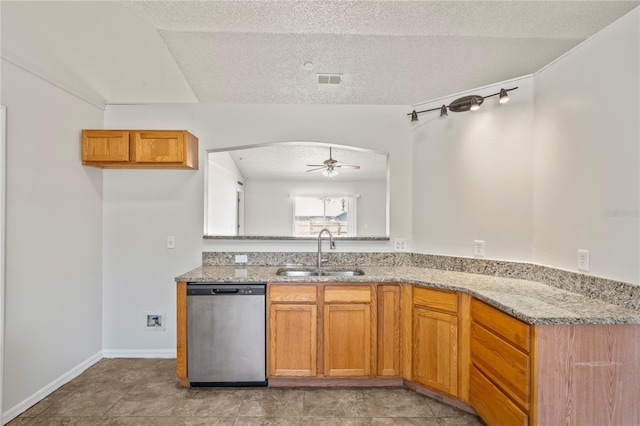 8461 Apple Orchard Rd, Spring Hill, FL 34608 - kitchen with dishwasher, a sink, light stone countertops, ceiling fan, and brown cabinets