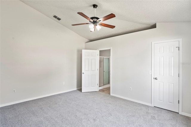8461 Apple Orchard Rd, Spring Hill, FL 34608 - unfurnished bedroom with lofted ceiling, a textured ceiling, carpet, baseboards, and ceiling fan