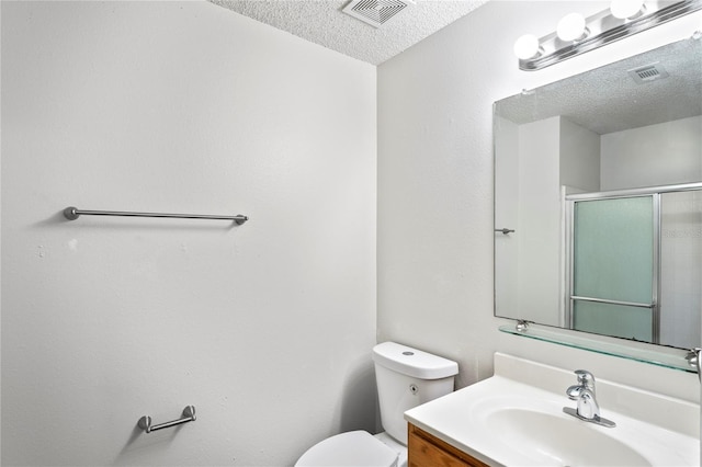 8461 Apple Orchard Rd, Spring Hill, FL 34608 - full bath with a textured ceiling, toilet, an enclosed shower, and vanity
