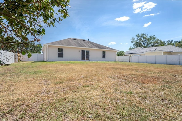 8461 Apple Orchard Rd, Spring Hill, FL 34608 - back of property featuring stucco siding