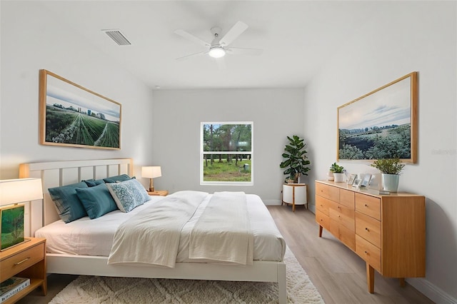 12331 Fulmar Rd, Weeki Wachee, FL 34614 - bedroom with light wood finished floors and ceiling fan