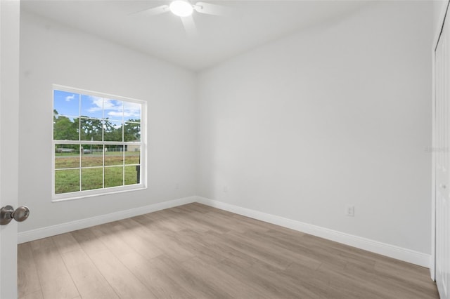 12331 Fulmar Rd, Weeki Wachee, FL 34614 - unfurnished room featuring light wood-style flooring and a ceiling fan