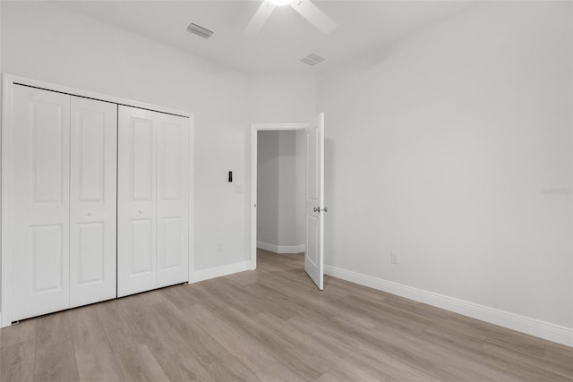 12331 Fulmar Rd, Weeki Wachee, FL 34614 - unfurnished bedroom featuring light wood finished floors, a closet, and a ceiling fan