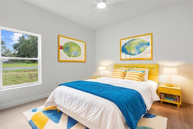 12331 Fulmar Rd, Weeki Wachee, FL 34614 - bedroom featuring wood finished floors and a ceiling fan