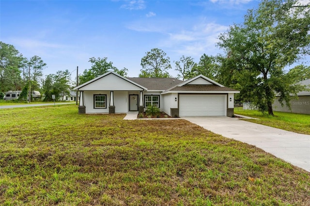 12331 Fulmar Rd, Weeki Wachee, FL 34614 - view of front facade with an attached garage, driveway, and a front lawn