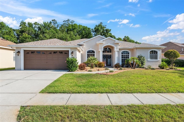 4080 Gevalia Dr, Brooksville, FL 34604 - view of front of property with an attached garage, driveway, a front yard, and stucco siding