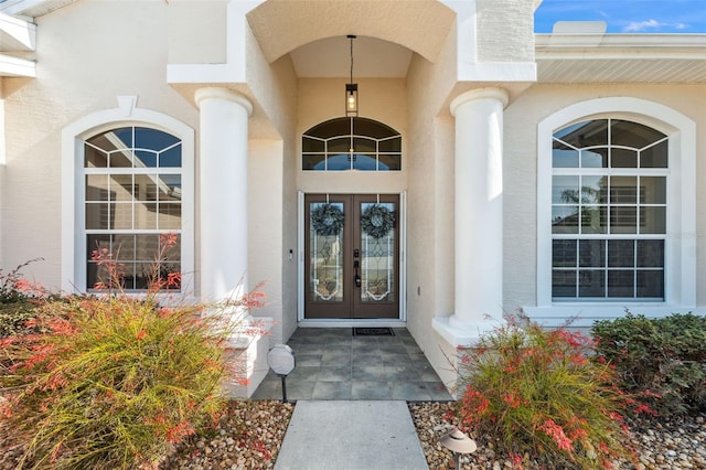 4080 Gevalia Dr, Brooksville, FL 34604 - doorway to property featuring stucco siding and french doors