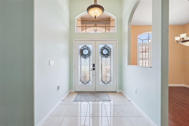 4080 Gevalia Dr, Brooksville, FL 34604 - entrance foyer featuring french doors, arched walkways, and baseboards