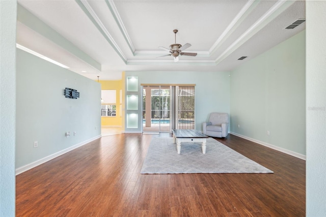 4080 Gevalia Dr, Brooksville, FL 34604 - unfurnished room with visible vents, ceiling fan, wood finished floors, and a tray ceiling