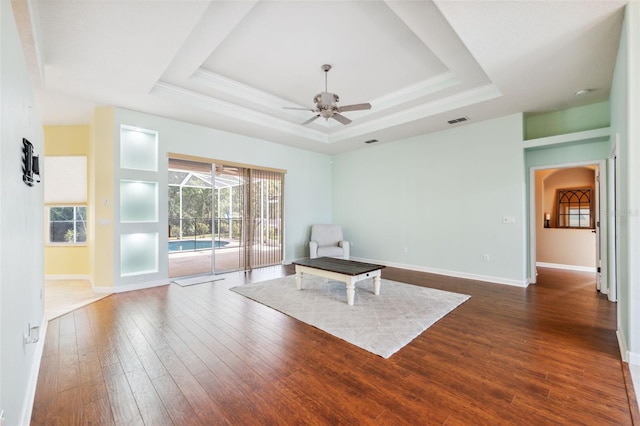 4080 Gevalia Dr, Brooksville, FL 34604 - unfurnished room featuring ceiling fan, a tray ceiling, dark wood finished floors, and visible vents