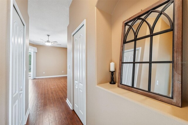 4080 Gevalia Dr, Brooksville, FL 34604 - hall with baseboards and hardwood / wood-style flooring
